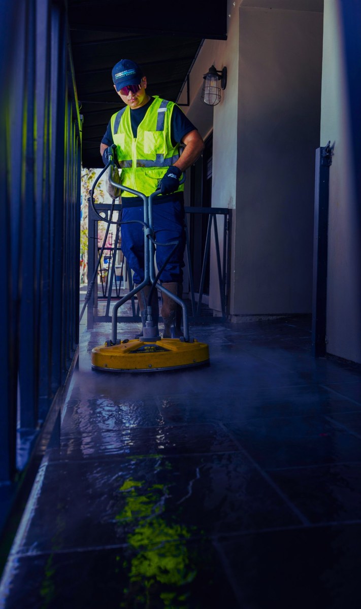 Local pressure washing professional with surface cleaner